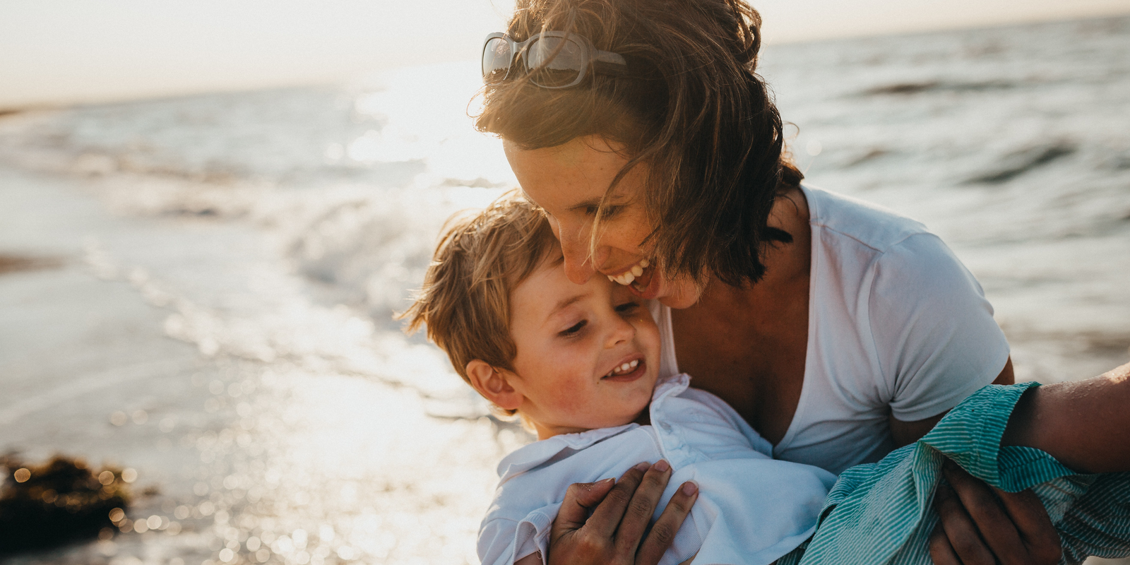 Biologica Spa Alchemy - happy mother and son on a beach