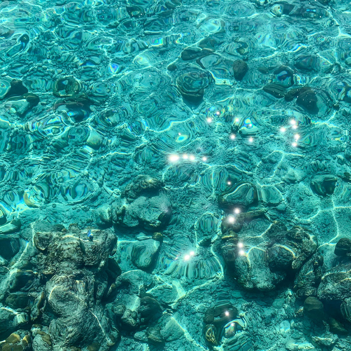 Sparkling water over a stony riverbed